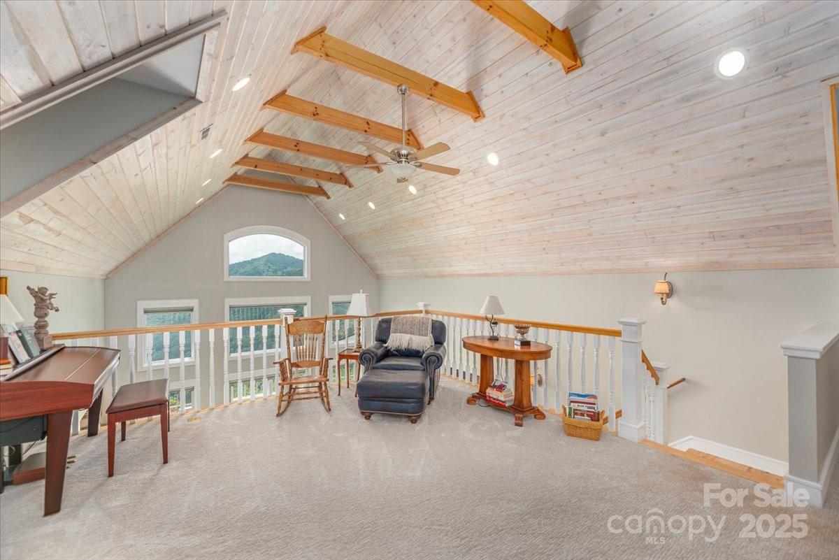 316 Fincher Mountain Road Waynesville, NC 28785 - Photo 38 of 46 a view of a livingroom with furniture and a ceiling fan