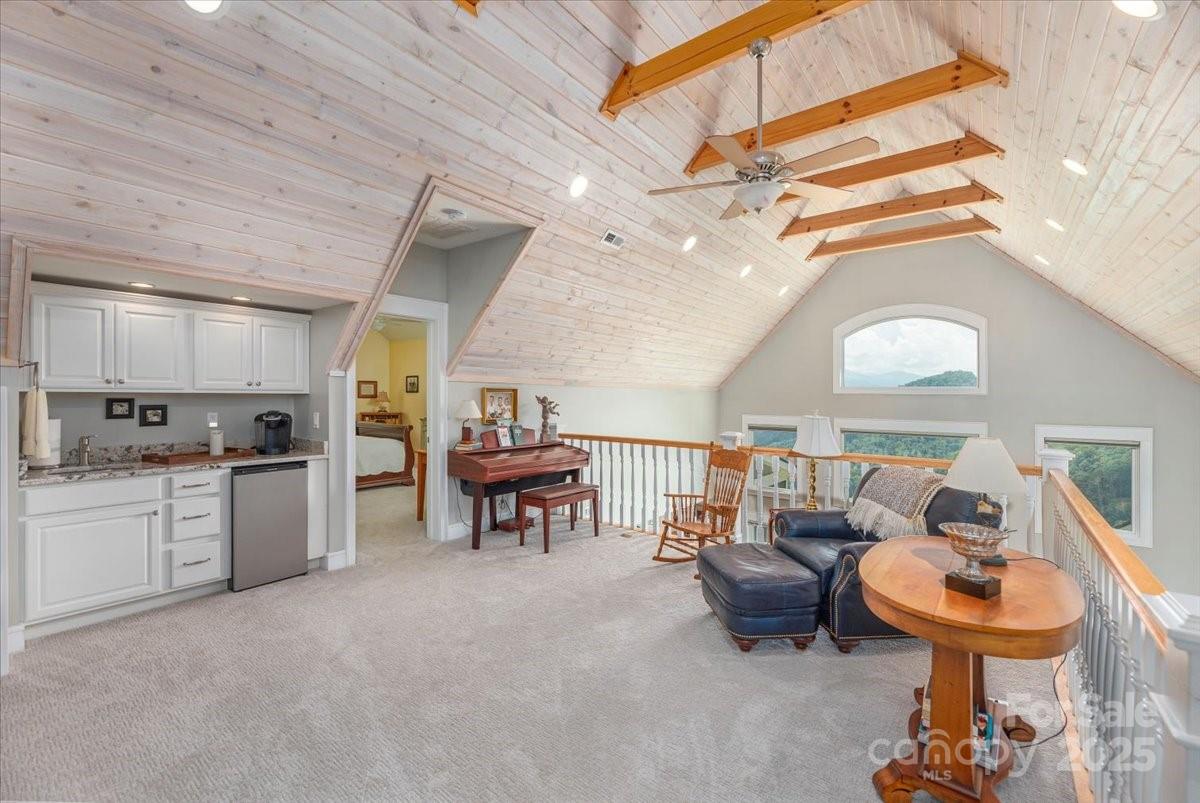 316 Fincher Mountain Road Waynesville, NC 28785 - Photo 39 of 46 a kitchen with furniture and a chandelier