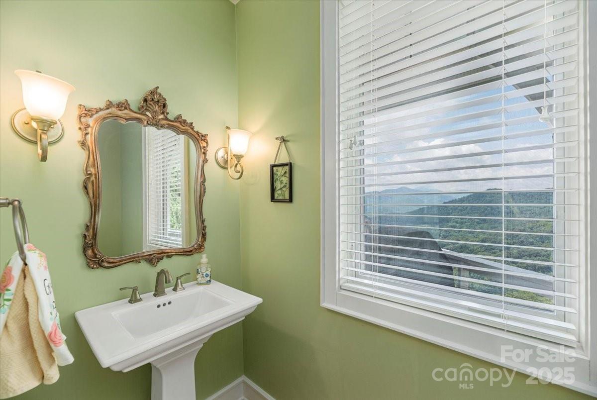 316 Fincher Mountain Road Waynesville, NC 28785 - Photo 8 of 46 a bathroom with a sink and a mirror