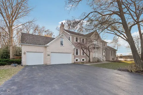 a view of a house with a snow in the yard