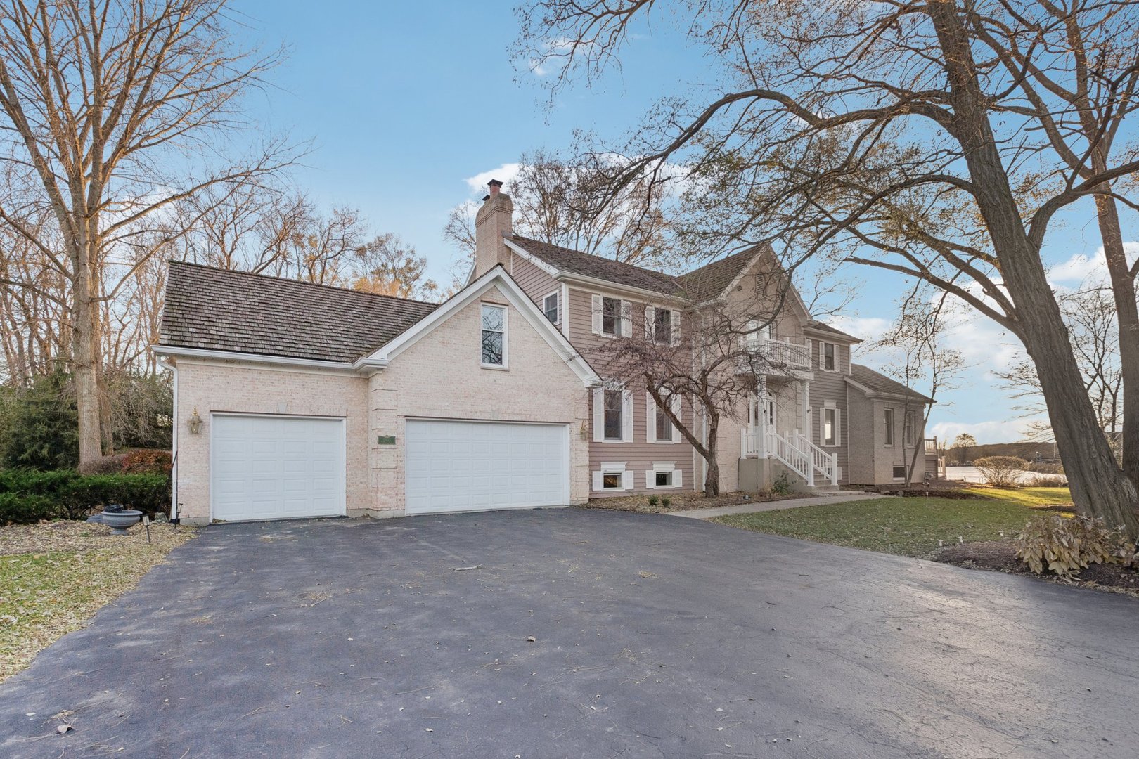 a view of a house with a snow in the yard