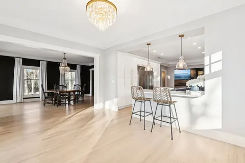 a kitchen with a stove and white cabinets