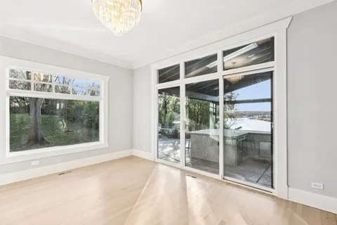a spacious bathroom with a tub sink shower and mirror