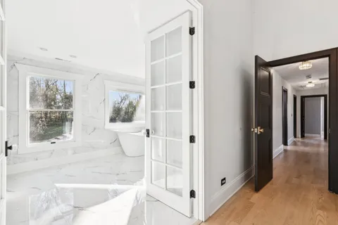 a bathroom with a bathtub and shower