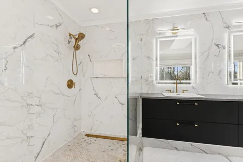 a view of an empty room with wooden floor and closet