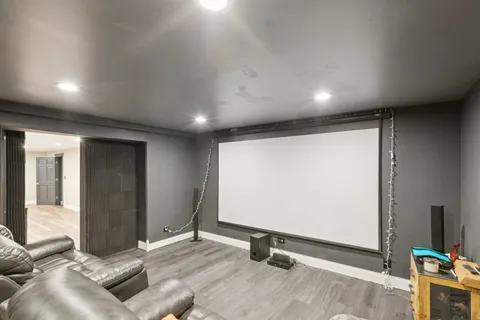 a view of a house with a yard and wooden fence