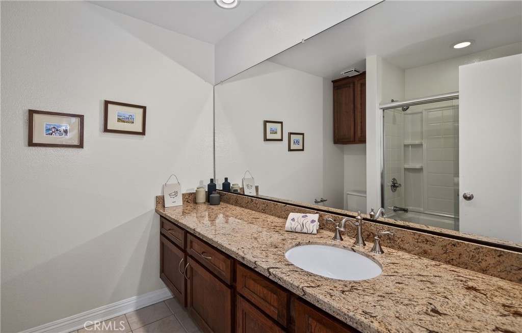 11984 Paradise Street Grand Terrace, CA 92313 - Photo 36 of 49 Upstairs Hall Bathroom Shower over tub