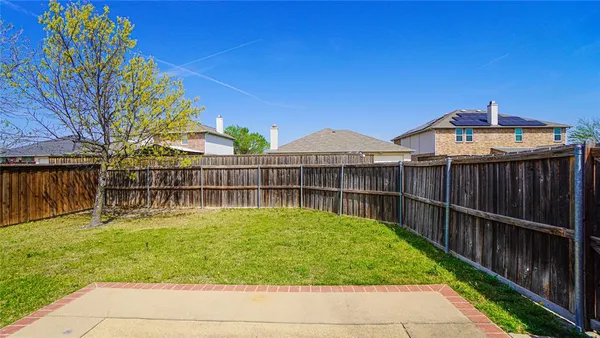 a view of a house with a wooden deck