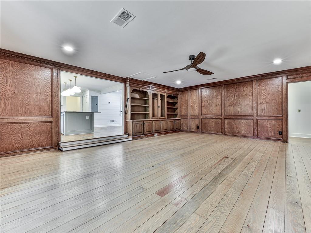 633 Butterworth Road Canton, GA 30114 - Photo 21 of 55 an empty room with wooden floor and windows