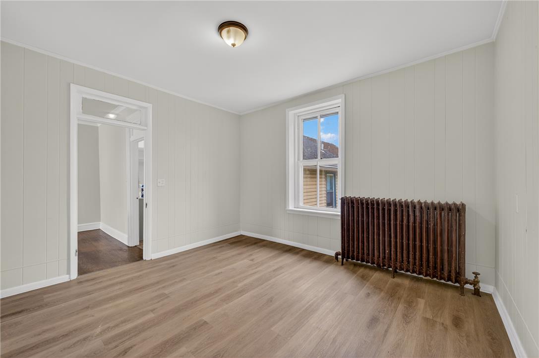 65 2nd Street Slatington, PA 18080 - Photo 36 of 46 This naturally illuminated room features durable flooring and a classic radiator, providing both comfort and style.
