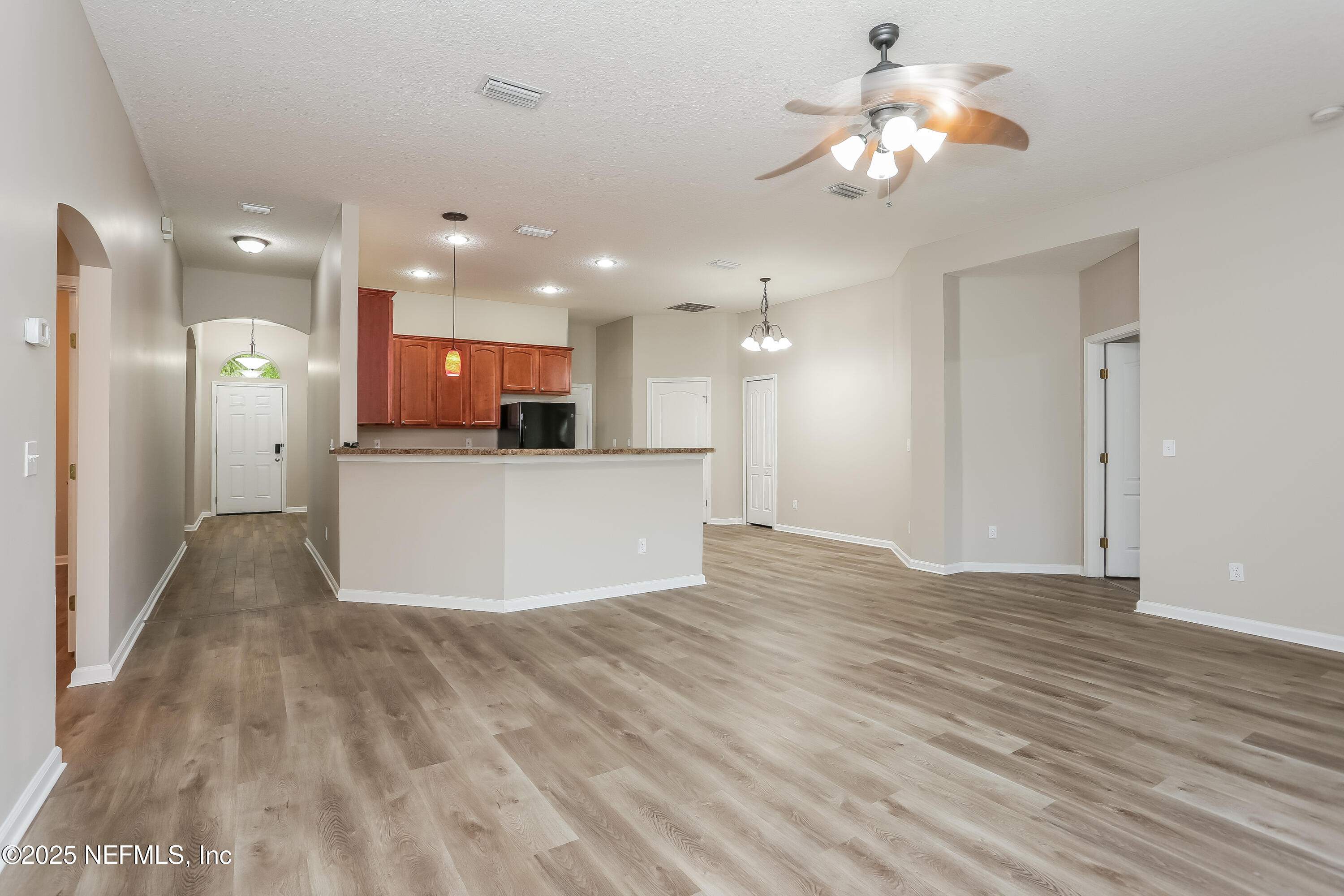 86016 Cherry Laurel Way Yulee, FL 32097 - Photo 2 of 15 a view of a kitchen with a sink and a refrigerator