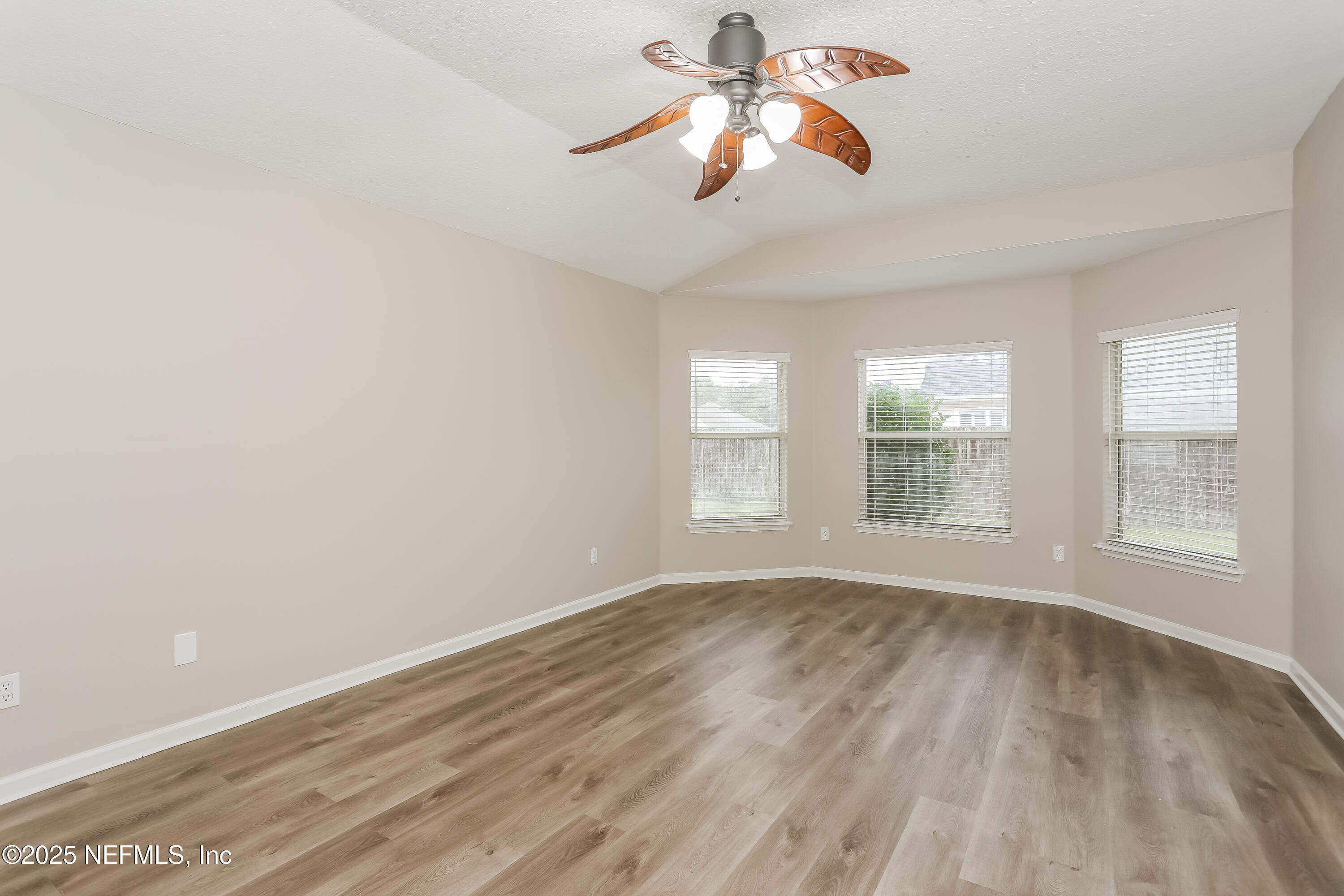 86016 Cherry Laurel Way Yulee, FL 32097 - Photo 10 of 15 wooden floor in an empty room with a window