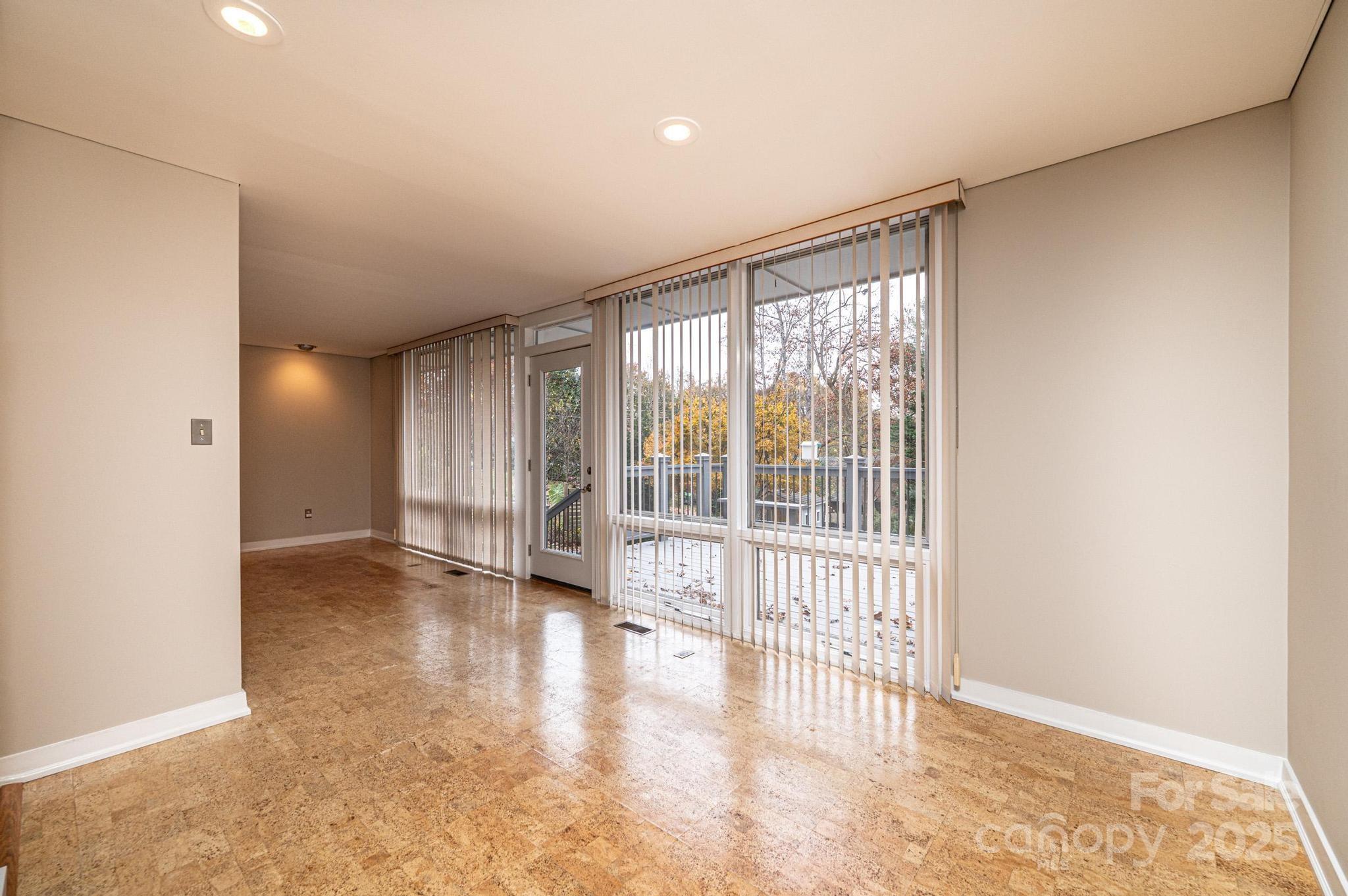 141 36th Avenue Northwest Hickory, NC 28601 - Photo 17 of 46 a view of an empty room with wooden floor and a window