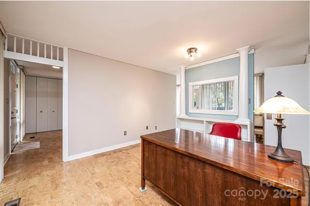 a workspace with furniture and window