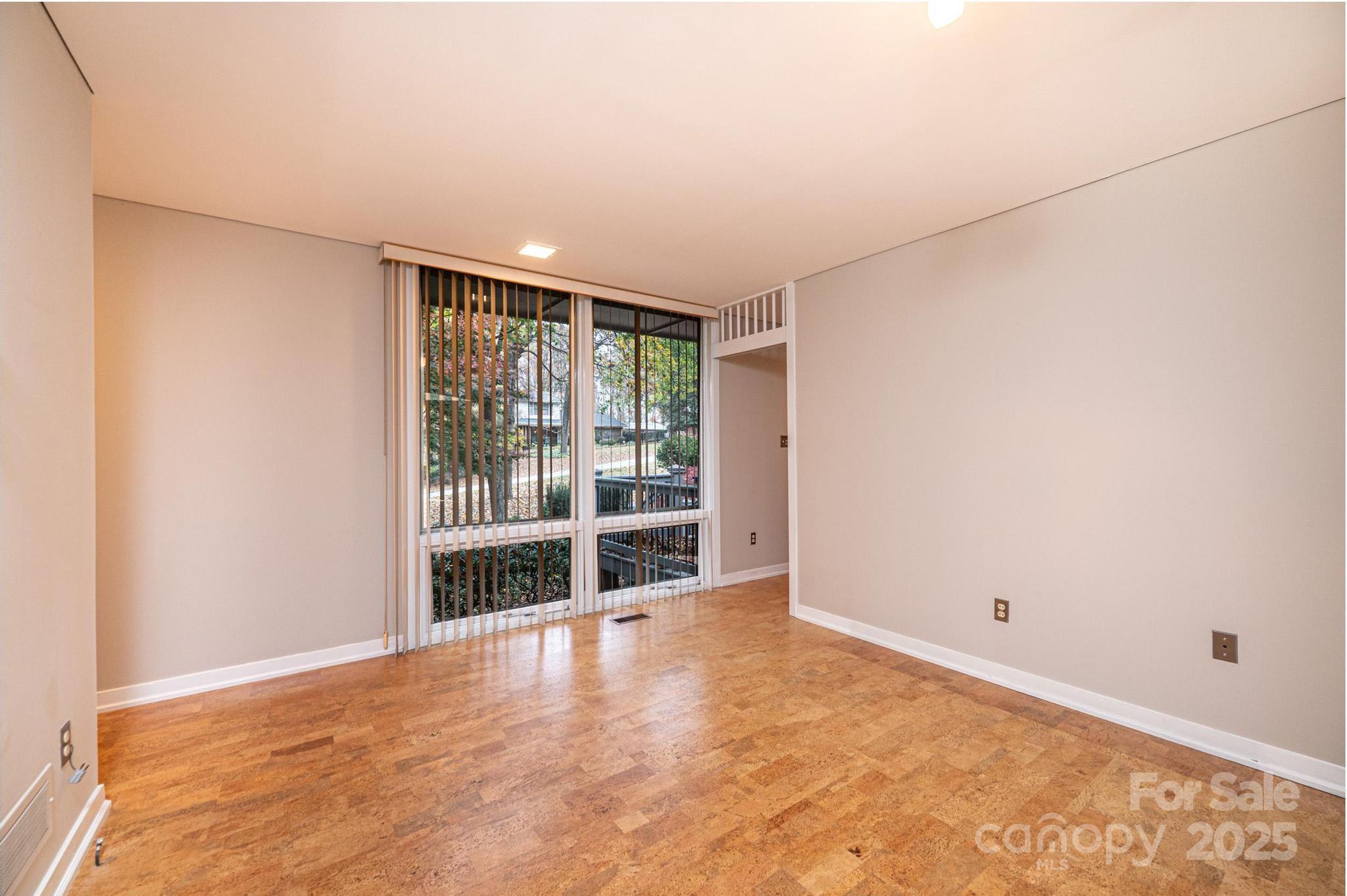 141 36th Avenue Northwest Hickory, NC 28601 - Photo 27 of 46 a view of an empty room with wooden floor and a window