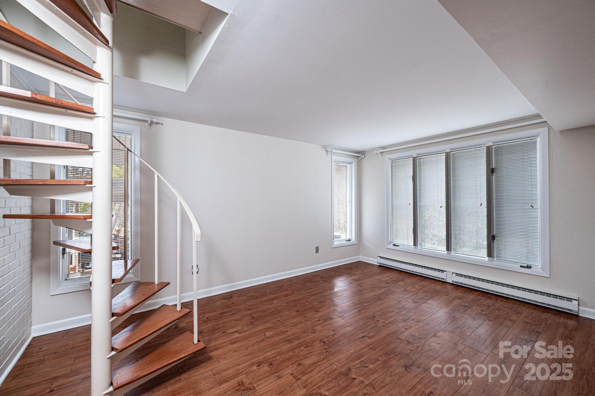 141 36th Avenue Northwest Hickory, NC 28601 - Photo 40 of 46 a view of an empty room with wooden floor and a window