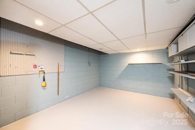 a room with a bed and a view of room