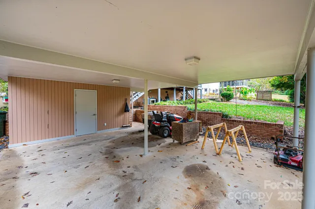 a view of a backyard with sitting area