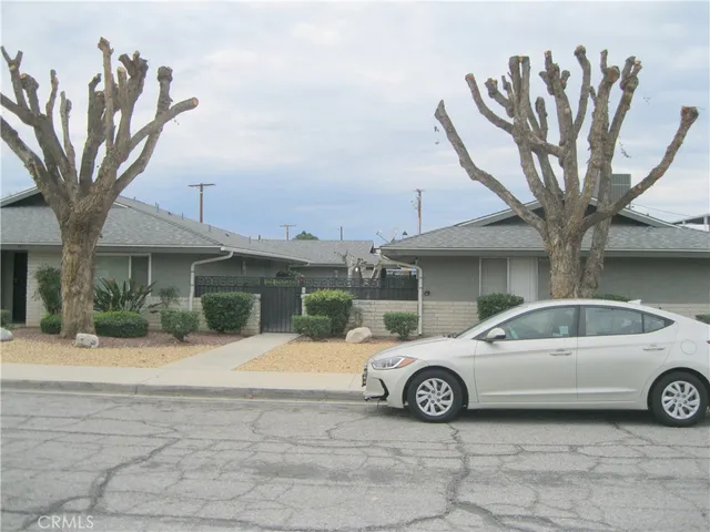 a view of a car parked in front of a building