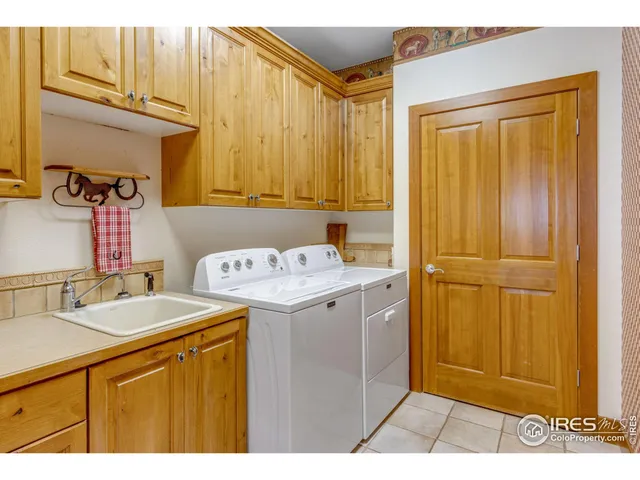 a utility room with a sink a washer and dryer