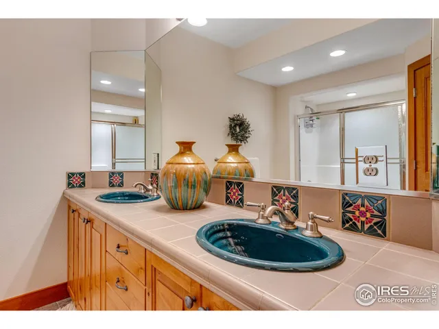 a kitchen with a sink a stove and a wooden floor
