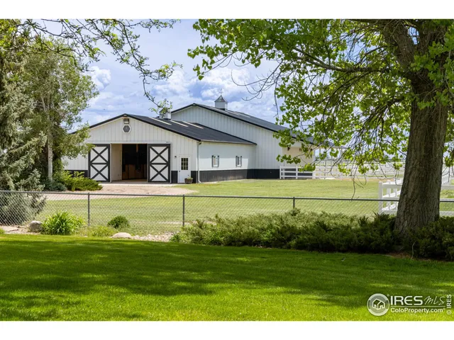 a view of a house with a big yard