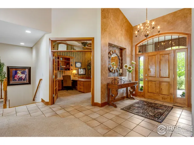 a view of livingroom with furniture and a chandelier
