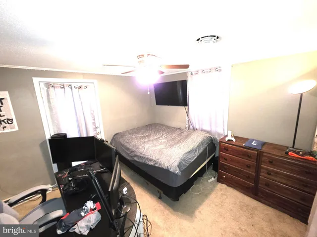 a bedroom with a bed and furniture