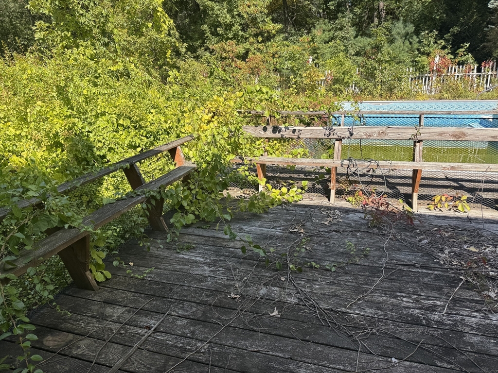 28 Lindbergh Street Clinton, MA 01510 - Photo 13 of 27 a view of a yard with wooden fence