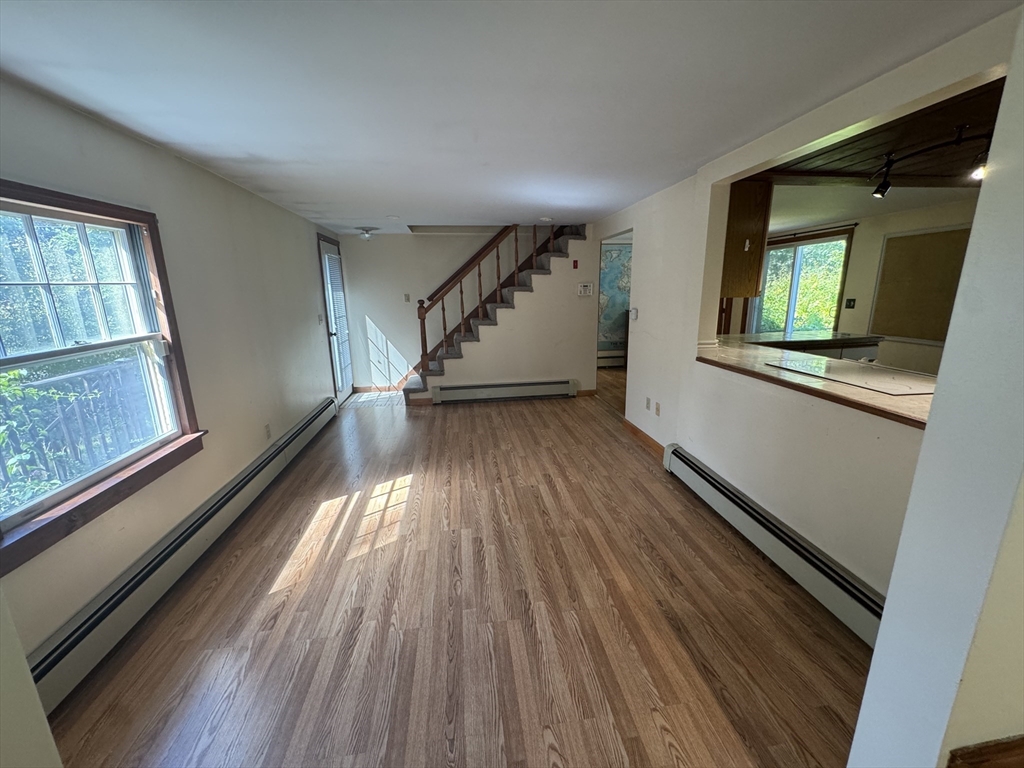 28 Lindbergh Street Clinton, MA 01510 - Photo 18 of 27 wooden floor in an empty room with a window