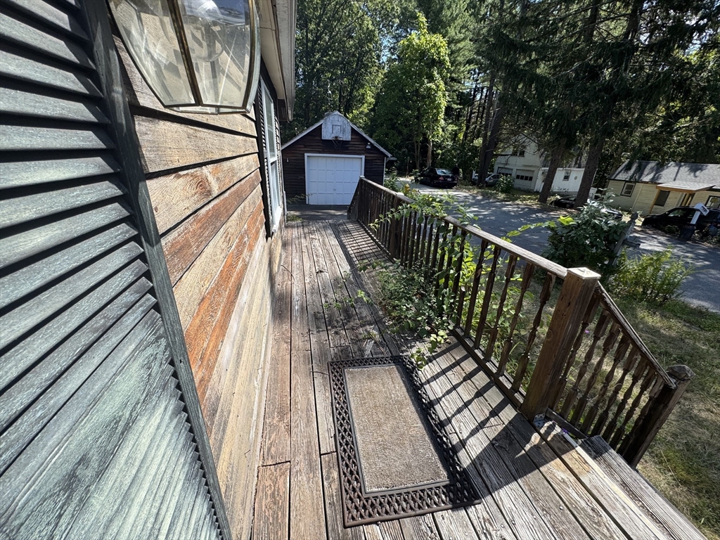 28 Lindbergh Street Clinton, MA 01510 - Photo 9 of 27 a view of balcony with wooden floor and fence