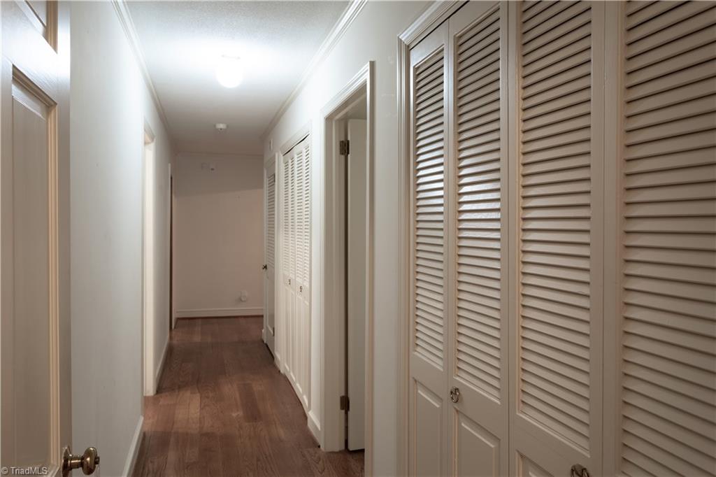 112 Magnolia Road Lexington, NC 27292 - Photo 25 of 46 The primary suite is tucked away on the back corner of the home. Complete with its own ensuite, this generous sanctuary is the ideal destination after a long day.