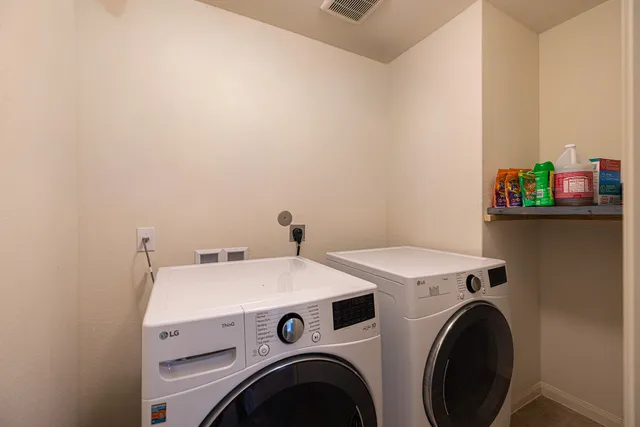 a view of a livingroom with furniture and a window