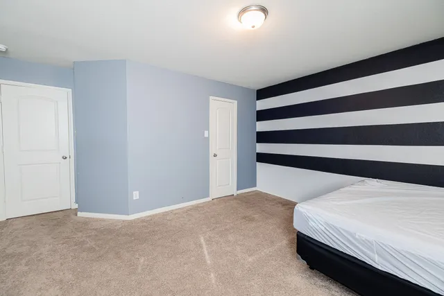 a room with a bed and a window