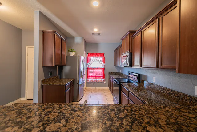 a room with lots of windows and furniture