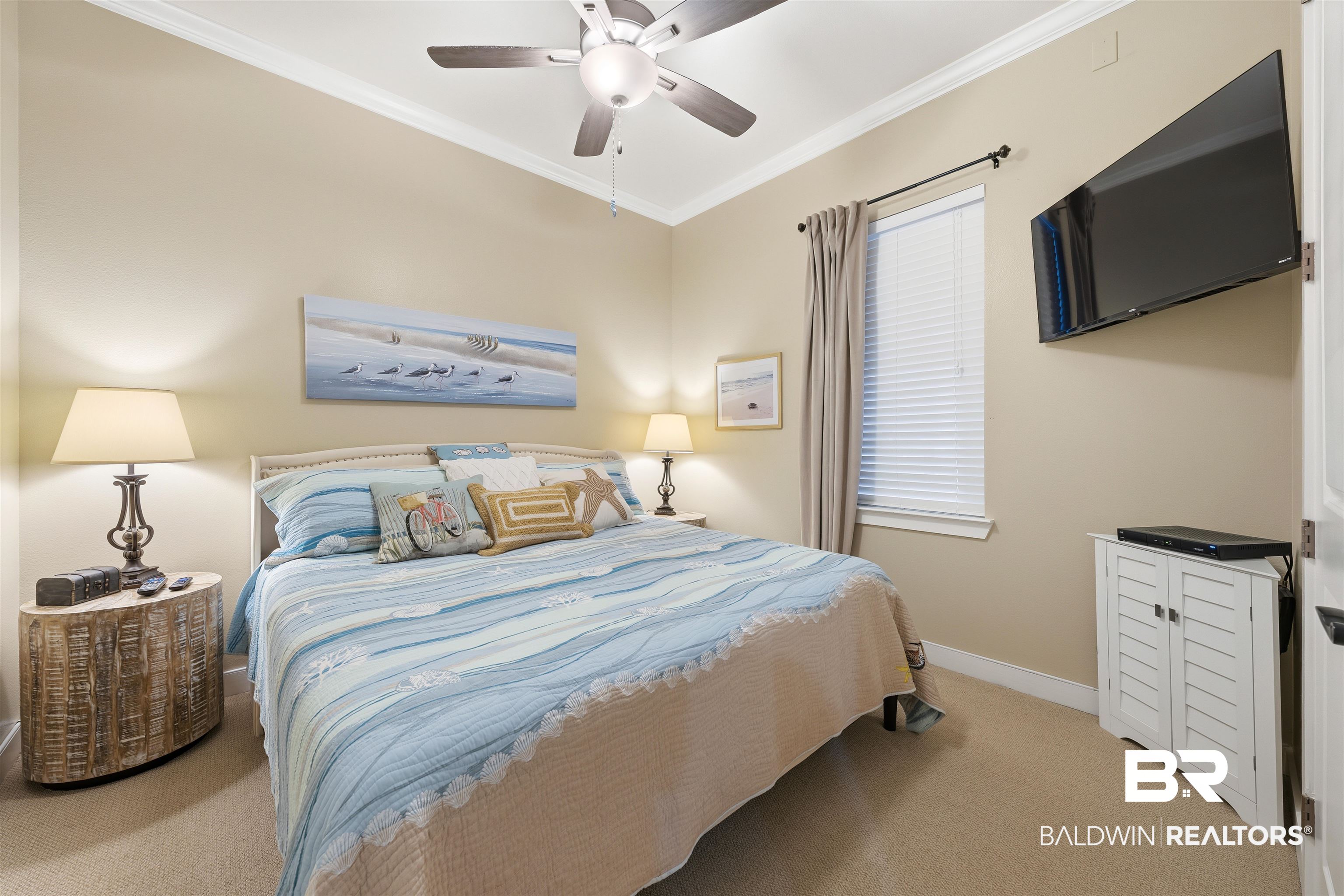 1430 Regency Road, Unit H202 Gulf Shores, AL 36542 - Photo 6 of 25 Bedroom featuring crown molding, carpet flooring, and ceiling fan
