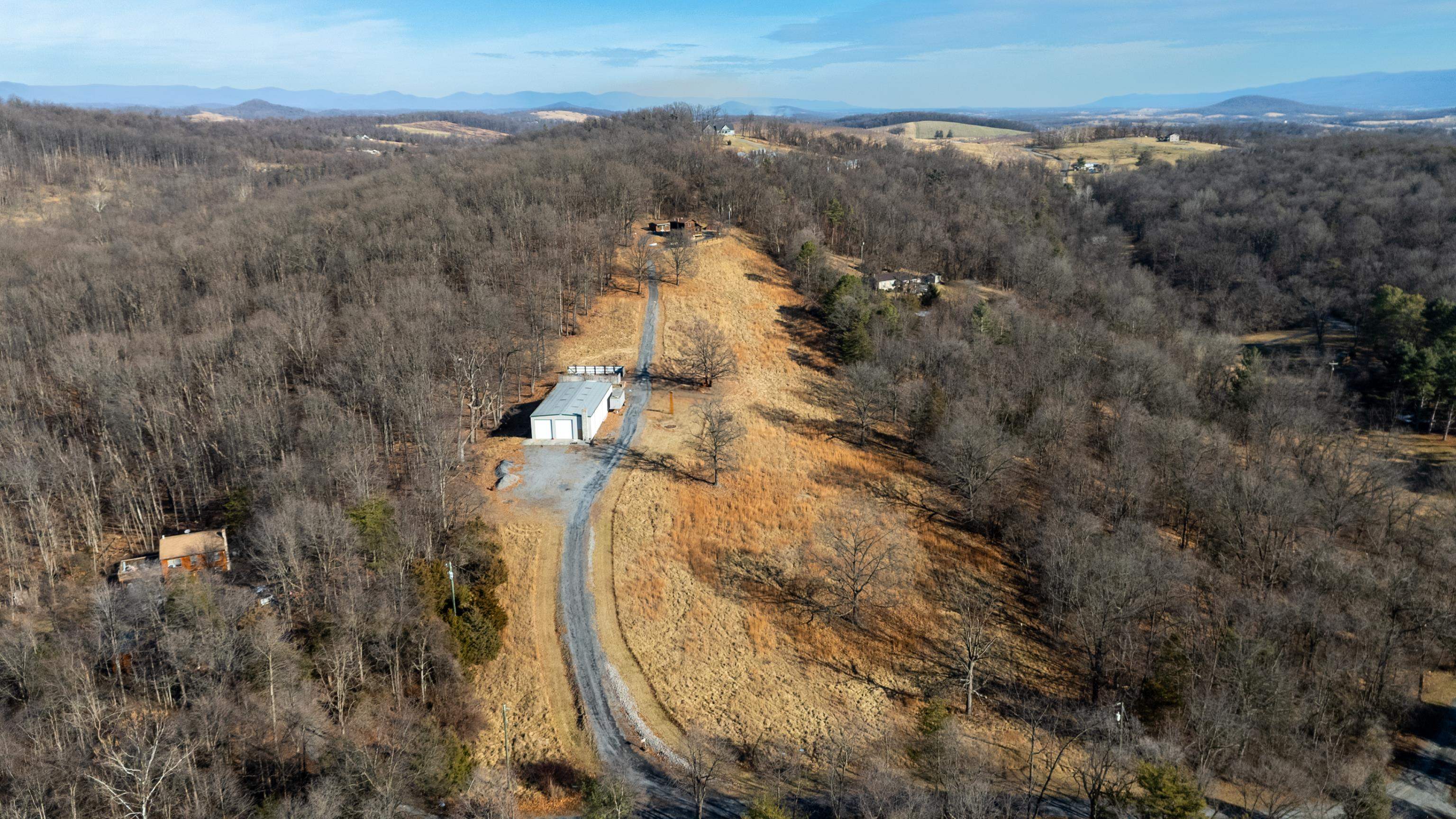 7386 Apple Ridge Drive Timberville, VA 22853 - Photo 11 of 62 an aerial view of house with yard and mountain view in back
