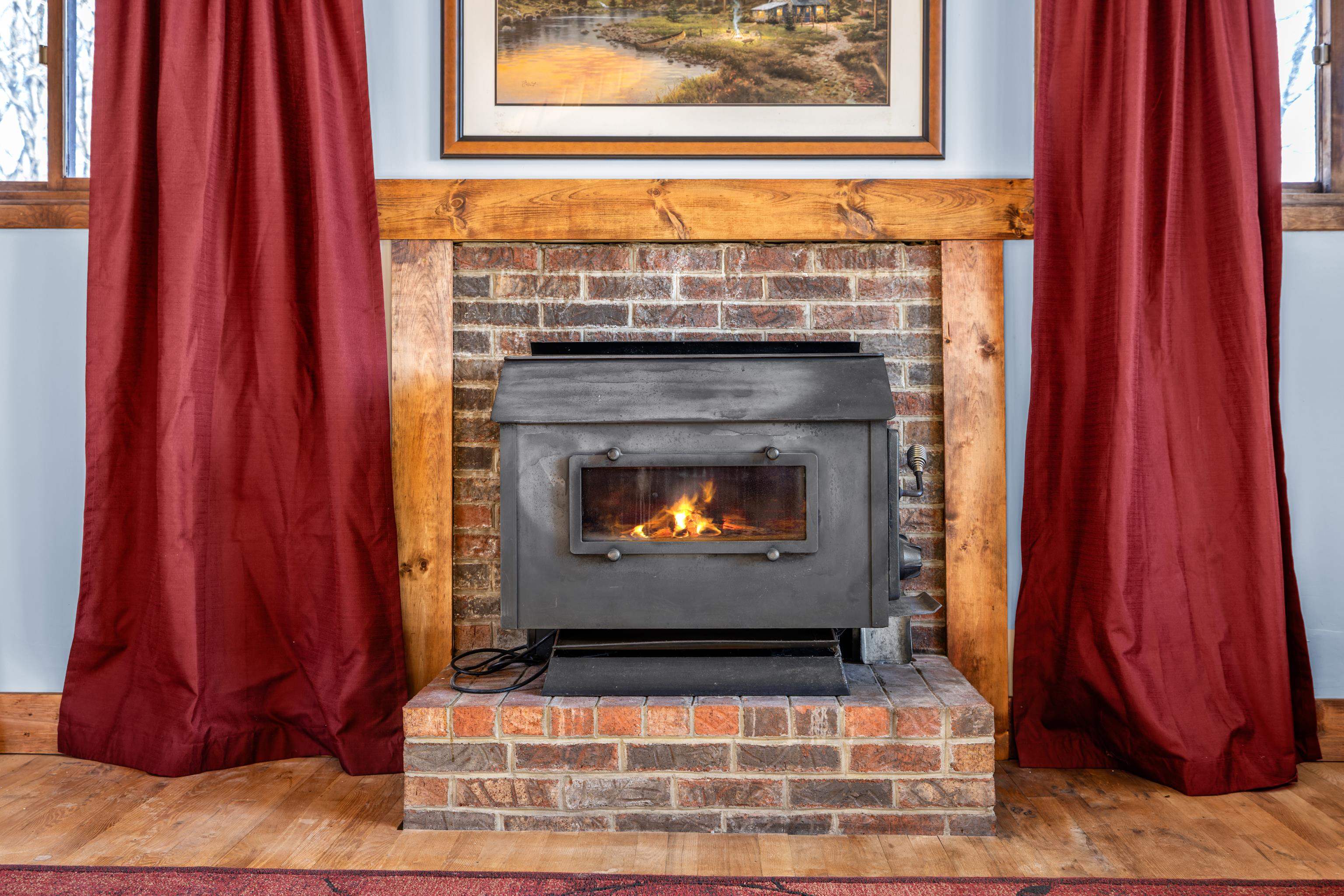 7386 Apple Ridge Drive Timberville, VA 22853 - Photo 14 of 62 a living room with a fireplace and a window