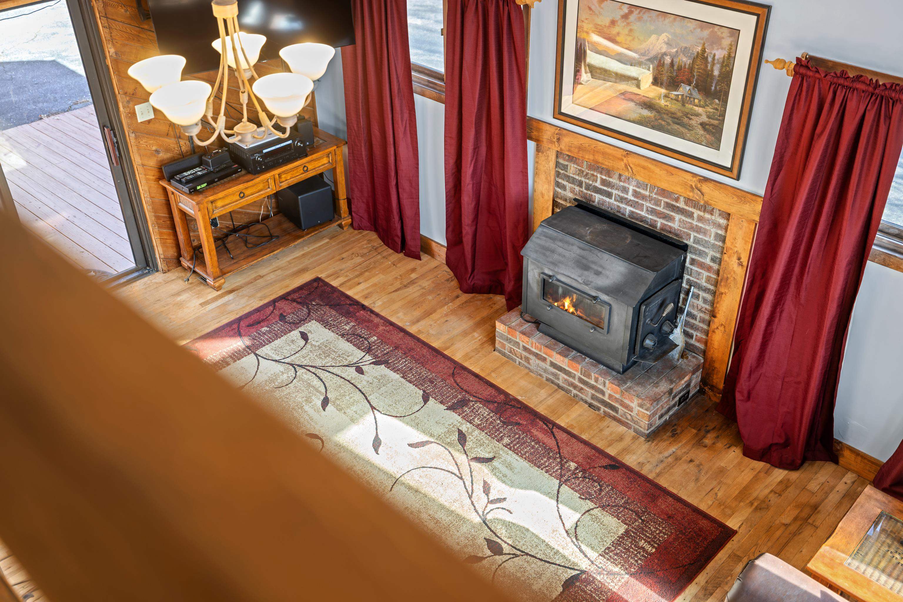7386 Apple Ridge Drive Timberville, VA 22853 - Photo 16 of 62 a living room with furniture with a fireplace