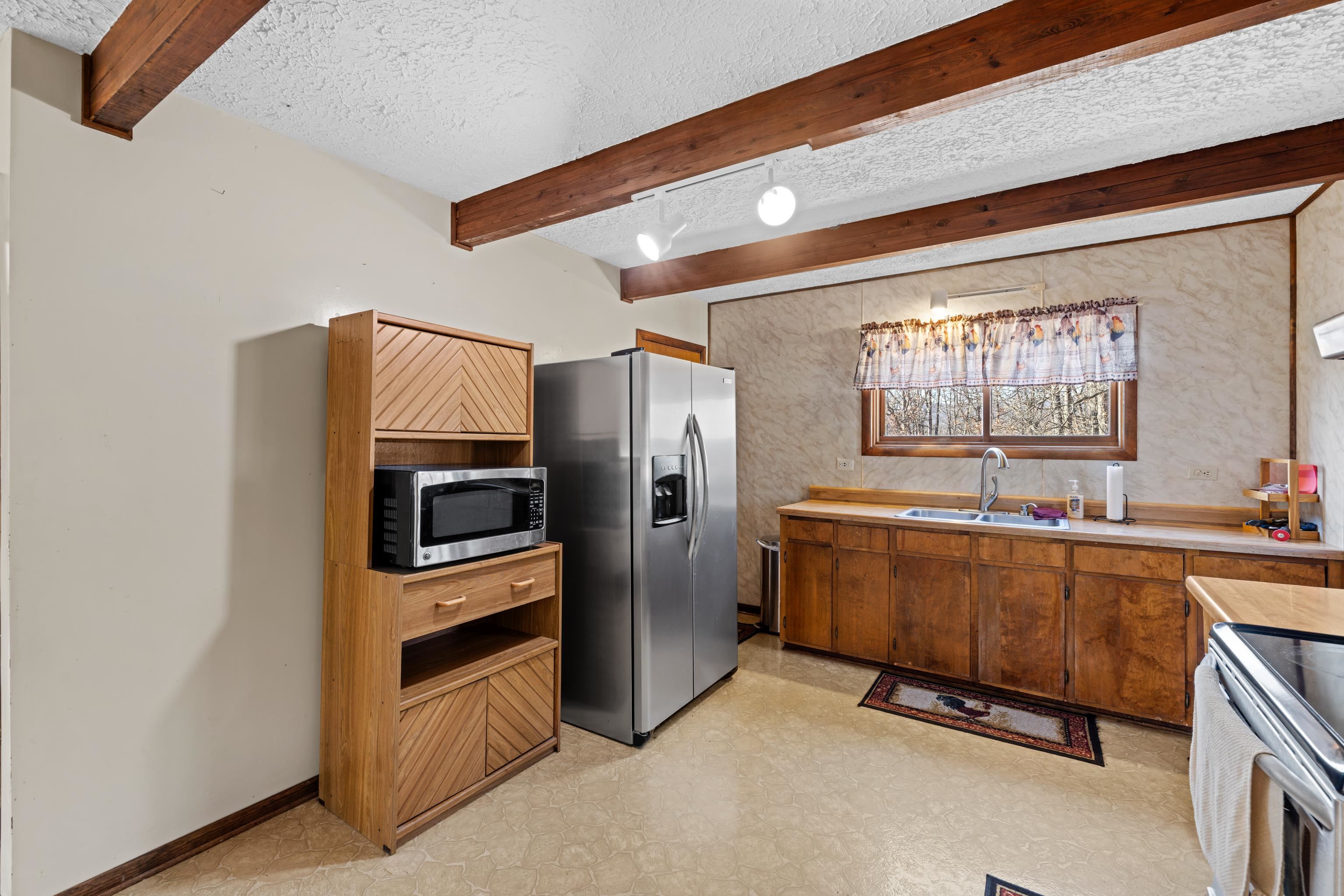 7386 Apple Ridge Drive Timberville, VA 22853 - Photo 24 of 62 a kitchen with stainless steel appliances a refrigerator and a stove