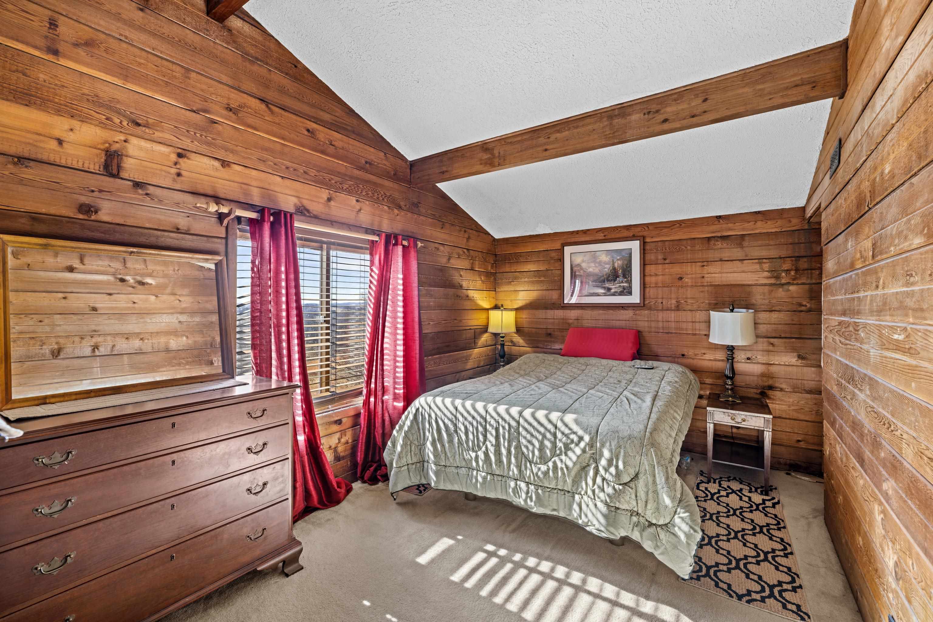 7386 Apple Ridge Drive Timberville, VA 22853 - Photo 27 of 62 a bedroom with a bed and a dresser next to a window