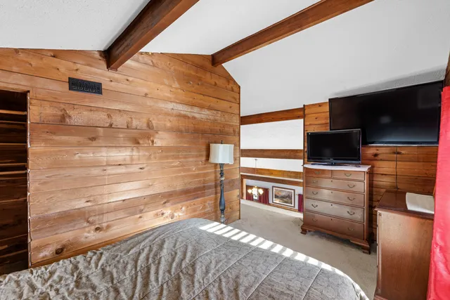 a room with furniture and a flat screen tv