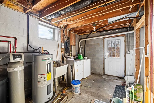 a kitchen with a sink cabinets and window