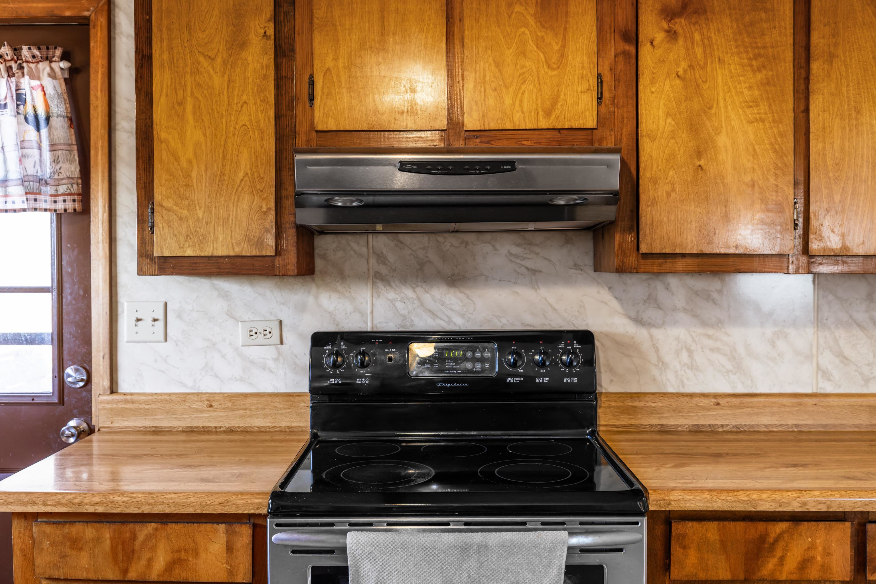 7386 Apple Ridge Drive Timberville, VA 22853 - Photo 41 of 62 a stove top oven sitting inside of a kitchen