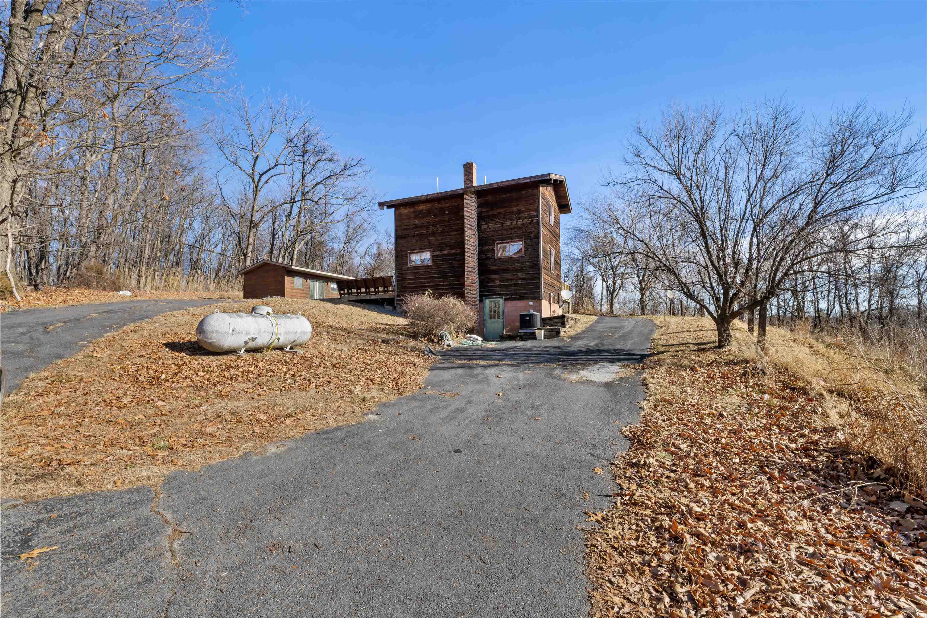7386 Apple Ridge Drive Timberville, VA 22853 - Photo 55 of 62 a backyard of a house with table and chairs