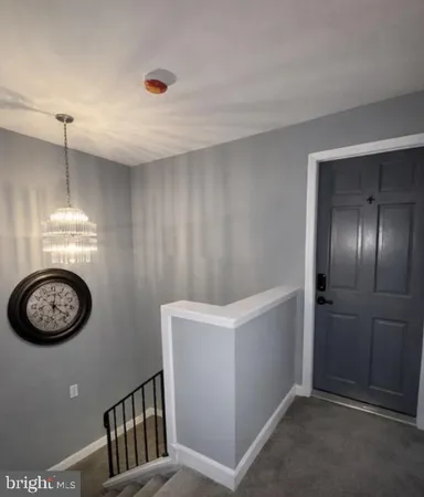 a view of a hallway with washer and dryer