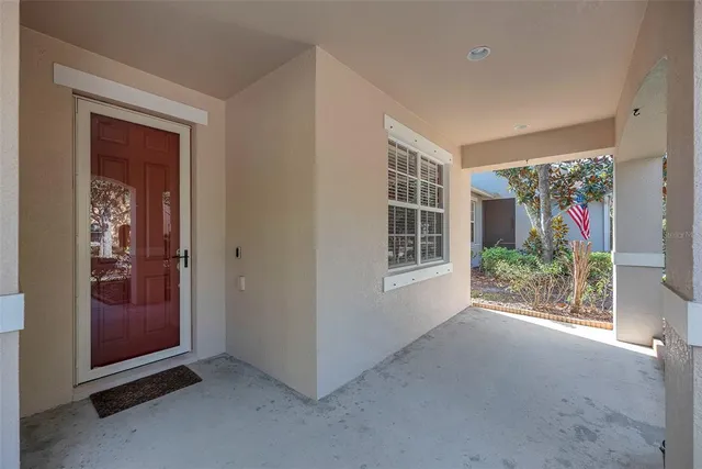 an empty room with windows and outdoor view