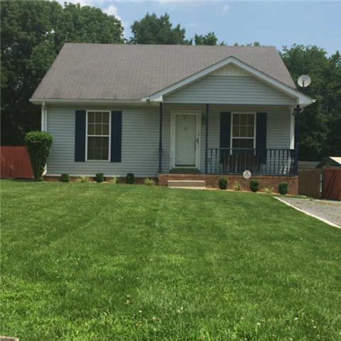309 Manzano Road Madison, TN 37115 - Photo 1 of 3 a front view of a house with a yard and trees