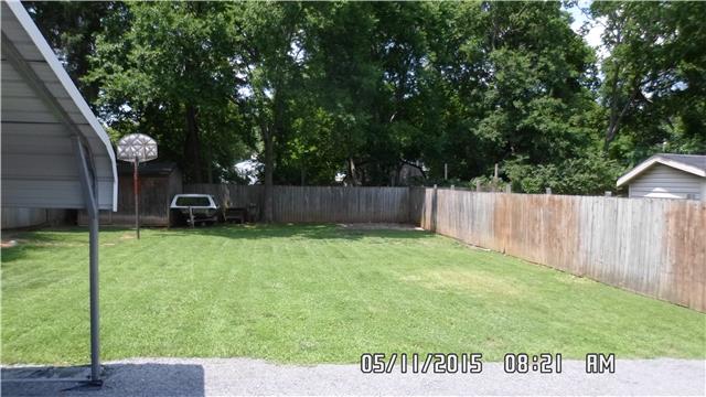 309 Manzano Road Madison, TN 37115 - Photo 3 of 3 a view of a backyard with a garden