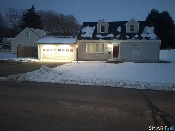 a front view of a house with parking space